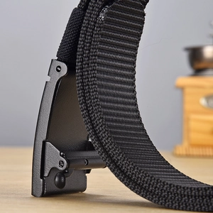 Close-up of matte black metal buckle and durable nylon weave texture of tactical belt
