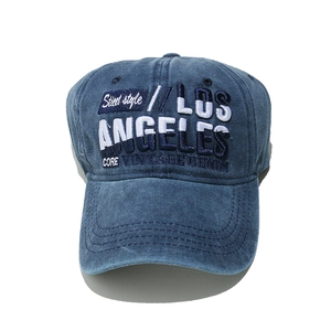 Close-up of the vintage washed blue denim fabric and Los Angeles 3D embroidery on the cap