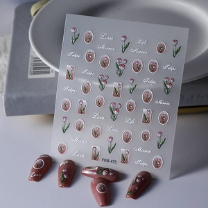 Detail of 5D embossed tulip nail art stickers with delicate textured floral patterns