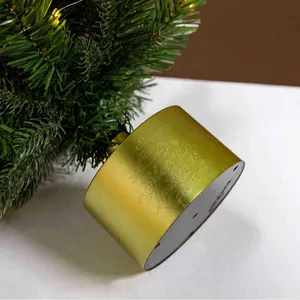 Mini Christmas tree with a rotating musical golden base and Merry Christmas lettering