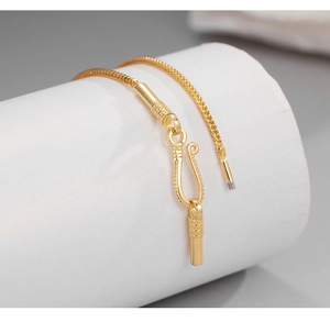 Detailed close-up of golden woven keel chain with a creative U-shaped clasp fastener