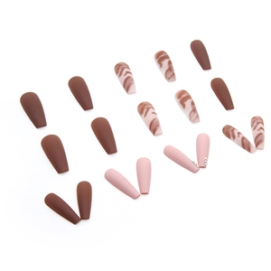 Long ballerina press-on nails in matte chocolate brown with glitter diamonds and tiger pattern