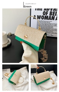Detail of green leather and straw woven handbag with golden ring handle and metal lock