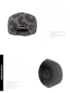 Detail of adjustable metal buckle and daisy pattern on denim gray newsboy cap