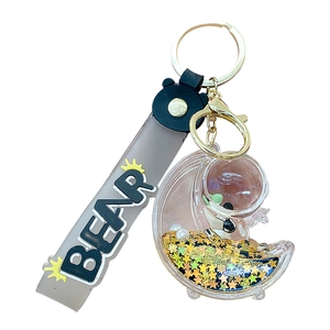 Porte-clés ours lune en sable mouvant avec crochet doré et bracelet silicone