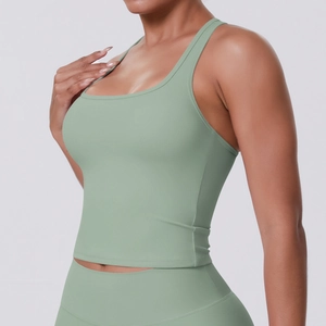 Detailed close-up of side view on mint green racerback sports bra with high-stretch fabric