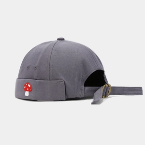 Detail of dark grey docker hat with mushroom embroidery and adjustable metal buckle