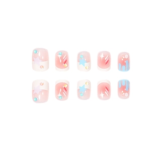 Rainbow star press-on nails with colorful rhinestones and blue drip design on pink base