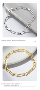 Detailed macro view of S925 sterling silver and 14K gold paperclip chain bracelets