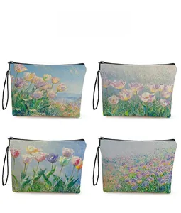 Detail display of floral impressionist oil painting patterns on cosmetic zipper bags