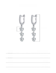 Macro shot of 925 sterling silver drop earrings with 5mm round cubic zirconia stones