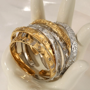 Elegant celestial open bangles with gold finish and rhinestone sun moon star motifs