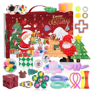 Detailed view of a Christmas countdown calendar box with various fidget toys