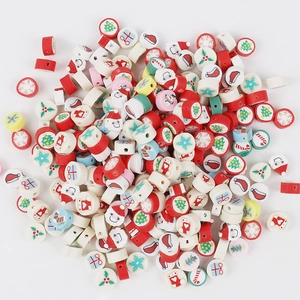 Detailed top view of festive Christmas polymer clay beads for DIY jewelry making