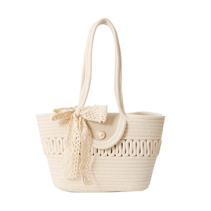 Minimalist cream woven bucket bag with elegant lace bow and pearl clasp detail