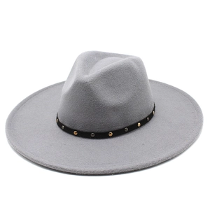 Detail of grey wool fedora featuring black band with gold and silver decorative studs
