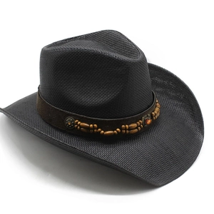 Detail view of a black woven cowboy hat with a beaded band and orange gemstone accent