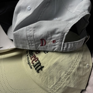 Detail of high-quality cotton baseball caps featuring premium 3D letter embroidery texture