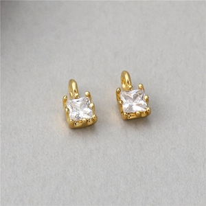 Close-up of gold plated square zircon charms with claw setting for jewelry making