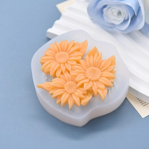 Sunflower silicone mold for chocolate and candles with finished orange floral crafts