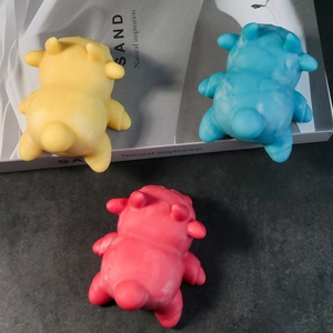 Three colorful cute animal silicone stress relief toys in yellow, blue and rose red