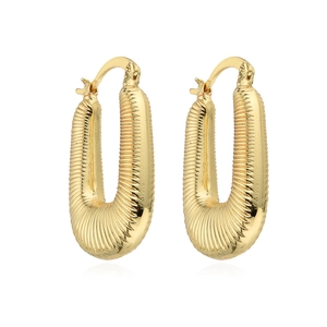 Bohemian gold ribbed hoop earrings with elegant U-shape design and metallic luster