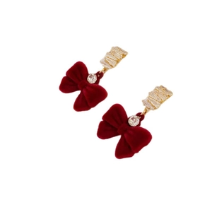 Boucles d'oreilles dorées 14k avec nœuds en velours rouge et pierres de zircone