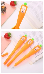 Close-up of creative carrot gel pens with cute rabbit figurines and green leaf caps