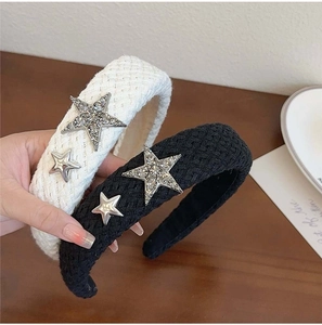 Detail of woven star headbands in black and white with sparkling crystal accents