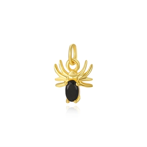 Macro shot of gold plated spider pendant with black oval gemstone for jewelry making