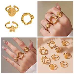 Detailed views of 18k gold-plated star rings with micro-inlaid crystals and adjustable bands