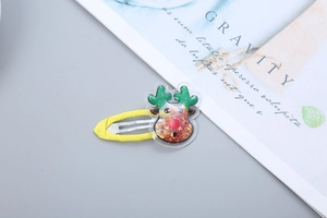 Detail of yellow reindeer hair clip with glitter sequins and soft fabric wrap for girls
