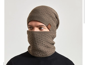 Detail of winter knitted beanie and neck warmer set with diamond texture and leather logo