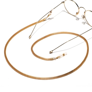 Golden 4.0mm woven metal eyewear chain with adjustable silicone loops and round glasses
