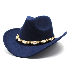 Detail of dark blue wool felt cowboy hat featuring ethnic shell and wood bead band