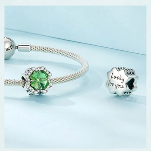 Detailed view of S925 silver clover charm with Lucky for you engraving on side