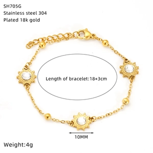 Detailed close-up of 18K gold-plated stainless steel sunflower bracelet with turquoise