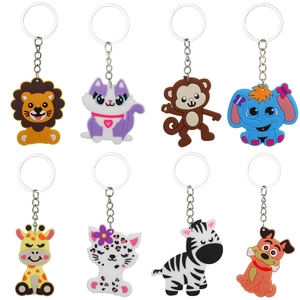 Collection of 8 cartoon jungle animal PVC keychains including lion cat and giraffe