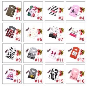 Macro display of 16 mini plastic jewelry gift bags with various printed patterns and handles