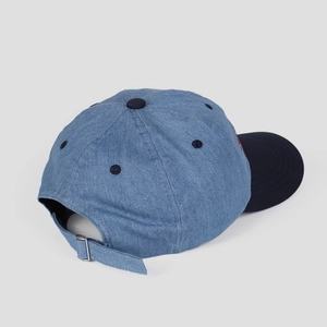 Detail of adjustable metal buckle and denim fabric stitching on the baseball cap