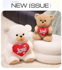 Close-up of plush teddy bears in white and brown with Love heart embroidery detail