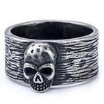 Detail view of vintage gothic skull ring with rustic texture in silver stainless steel
