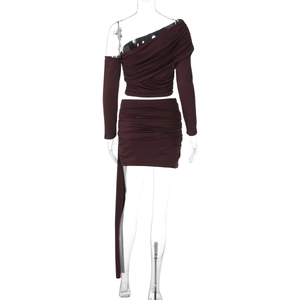 Detail view of burgundy off-shoulder top and ruched mini skirt with drawstring texture