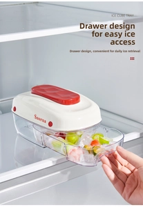 Detail of drawer-style ice cube tray with push lid inside a modern refrigerator