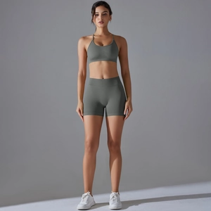 Close-up of grey-green seamless knit yoga set featuring ribbed texture and slim straps