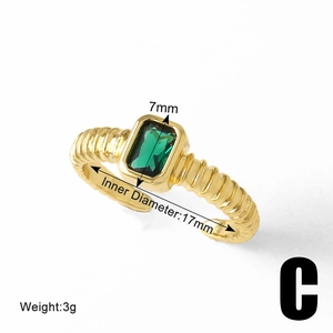 Close-up of gold bow heart ring with green stone, showing 17mm inner diameter and 3g weight