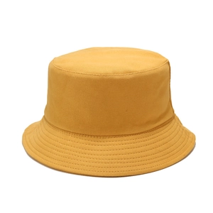 Classic yellow cotton bucket hat with parallel stitching and foldable sun protection design