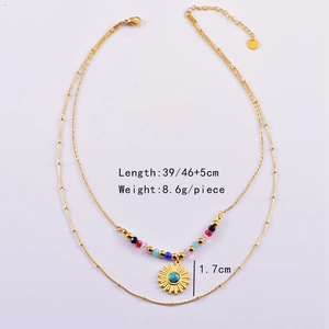 Detailed specs of double-layer beaded necklace with turquoise sunburst pendant