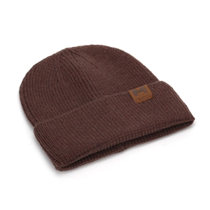 Close-up of chunky knit pattern and leather 'Fashion' logo on dark brown winter beanie