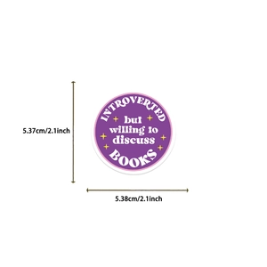 Detail showing 2.1-inch round vinyl sticker with Introverted Books slogan and dimensions